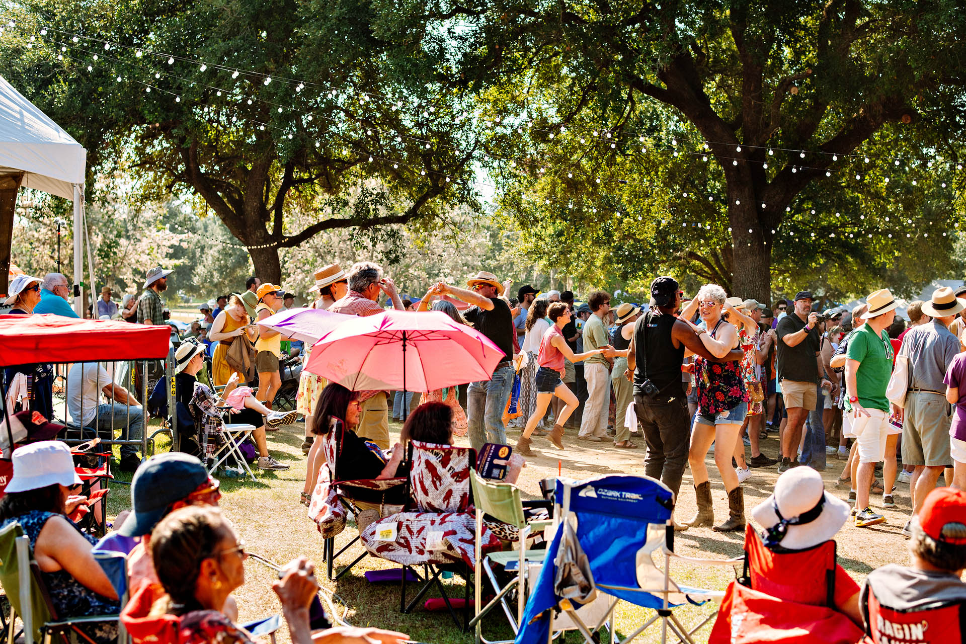 Festival crowds dancing at Festivals Acadiens et Créoles in Lafayette, Louisiana.