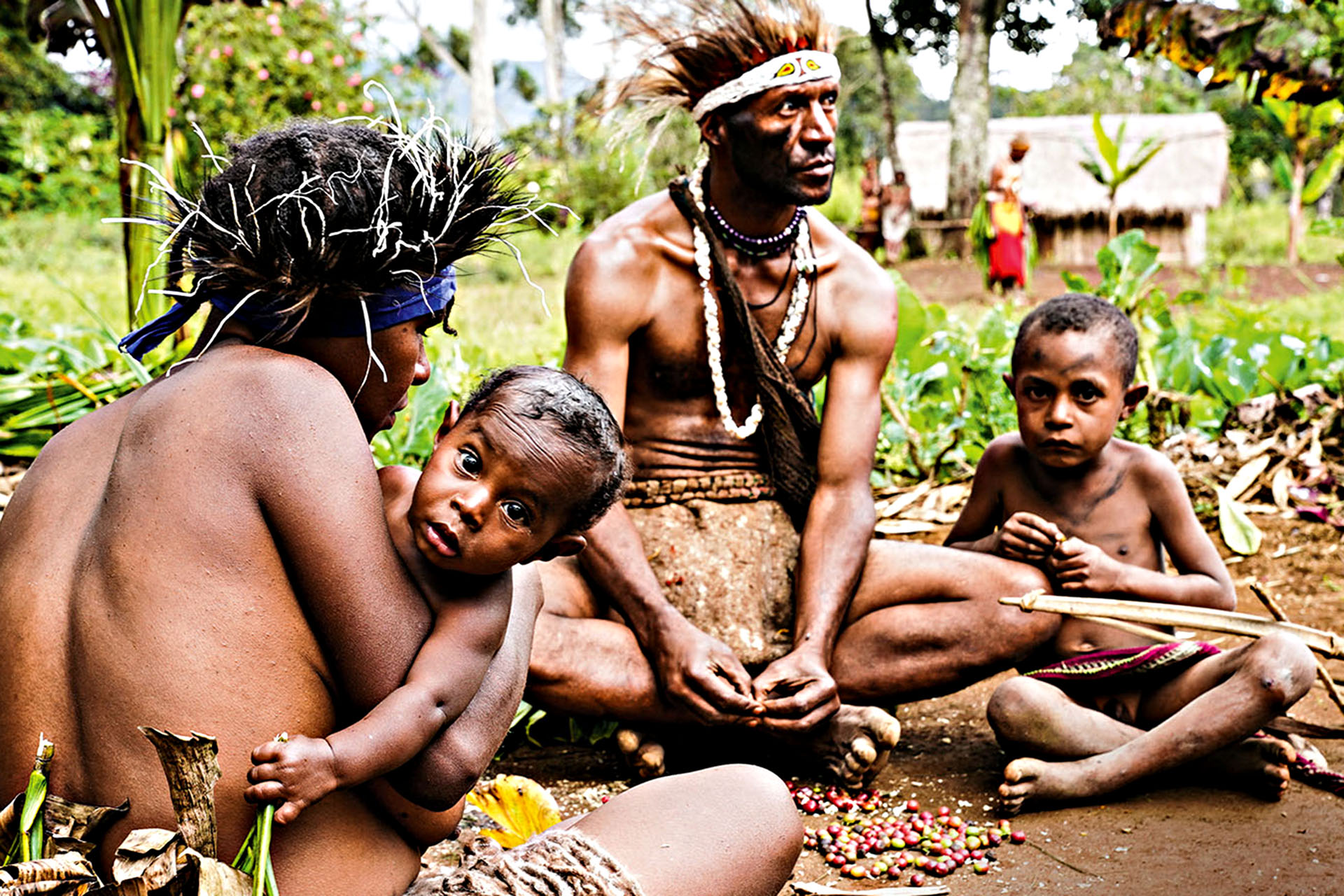 Highlands family gathered outside their village home in Korul Village, Papua New Guinea.