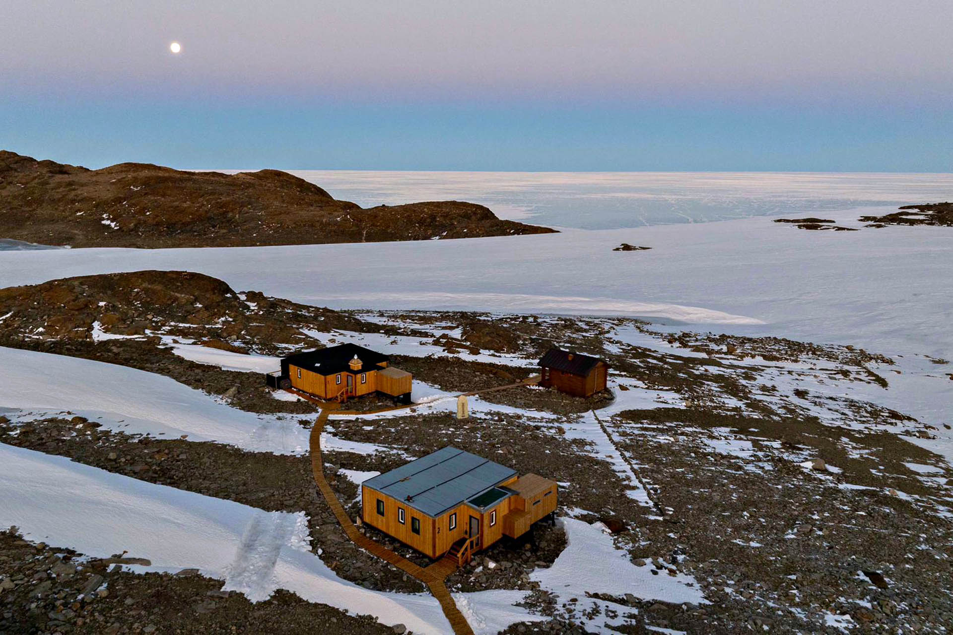 Ultima Camp accommodation surrounded by snow and ice during a remote Antarctica expedition.