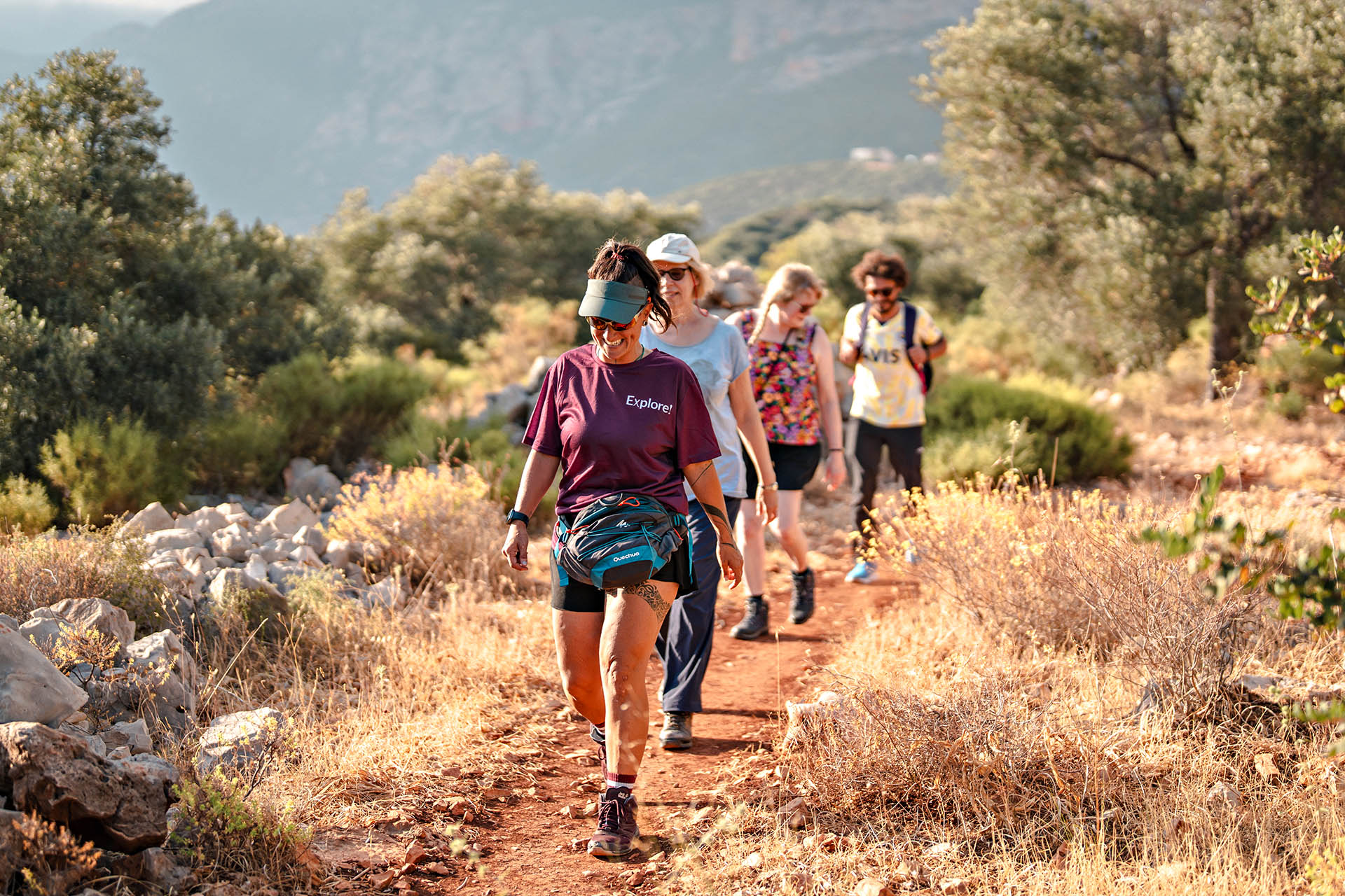 Explore Worldwide group hiking through a rugged mountain landscape on a small-group walking adventure.