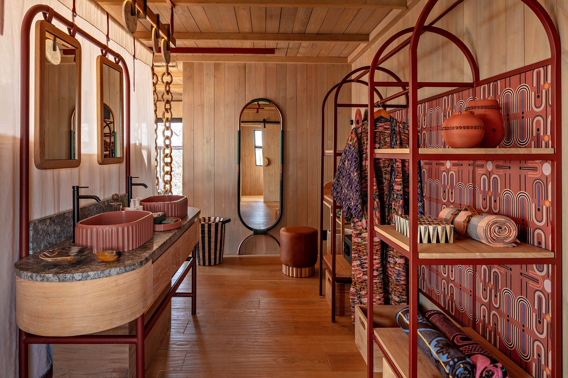 Colourful bathroom and dressing area inside a suite at Anantara Kafue River Tented Camp, Zambia.