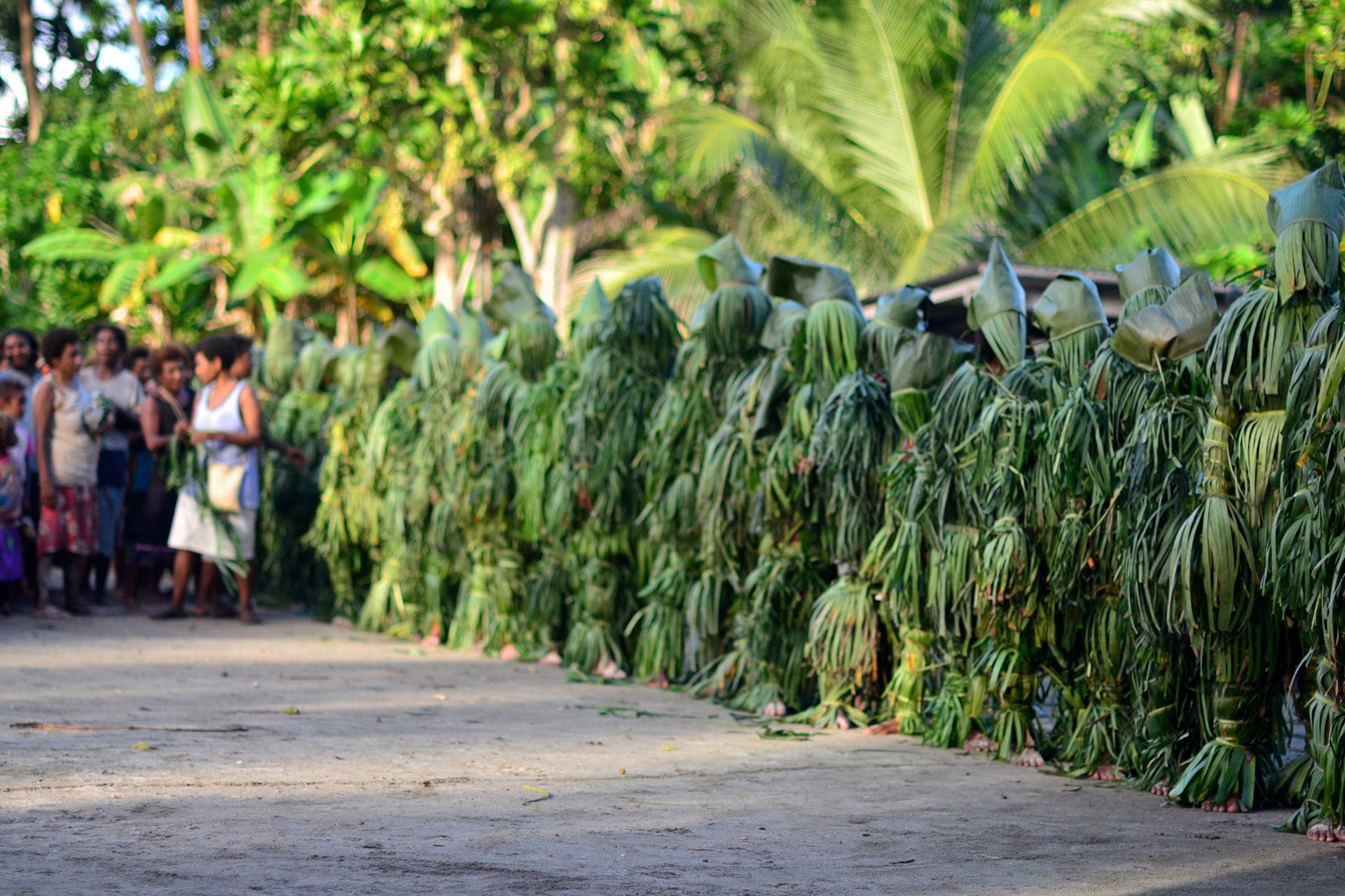 Women dress as 'Qarates' (bush women), line up before throwing stones at a few unlucky men.