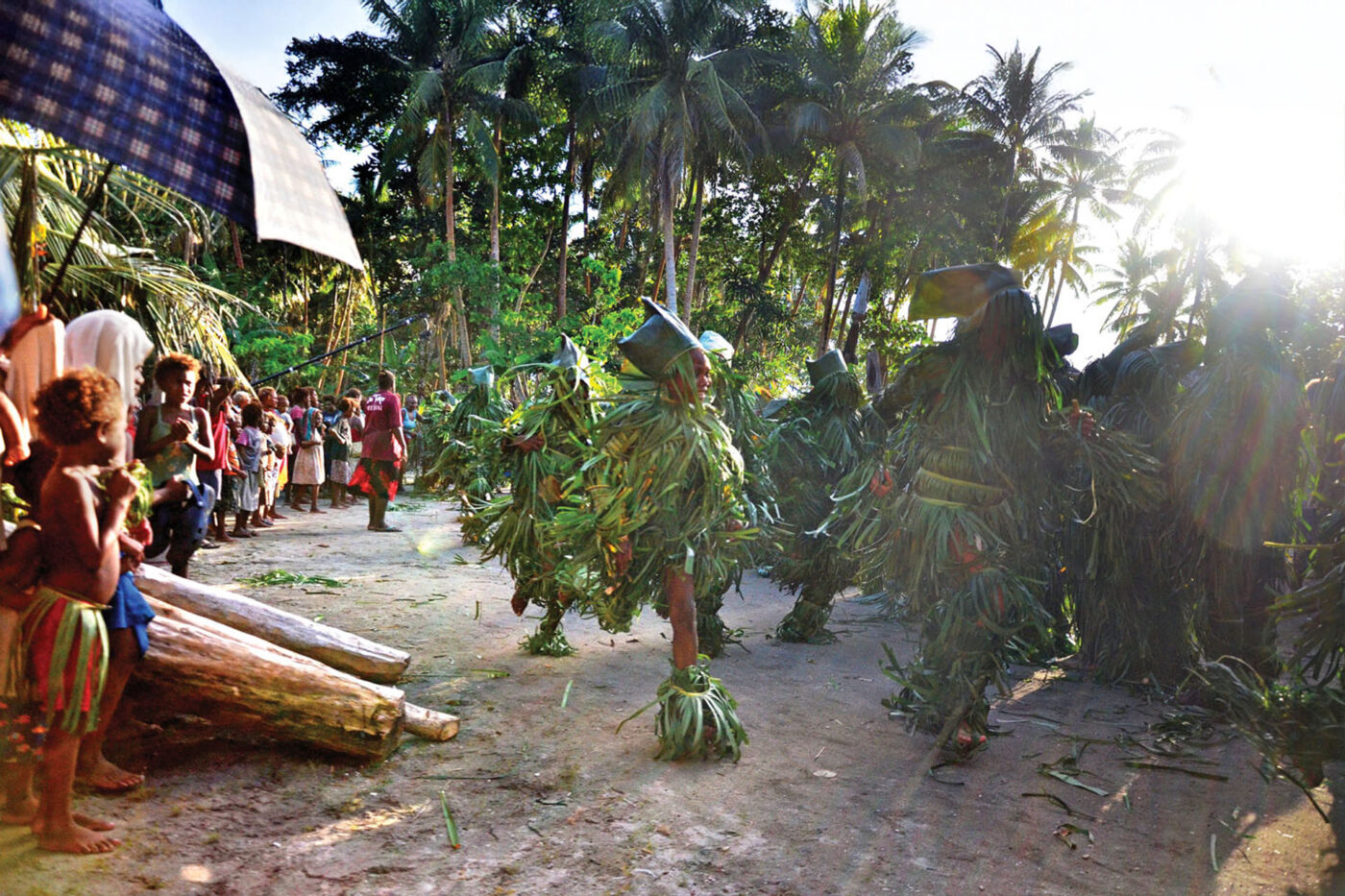 The bush women throwing stones at the men to mark the end of the three-day festival.