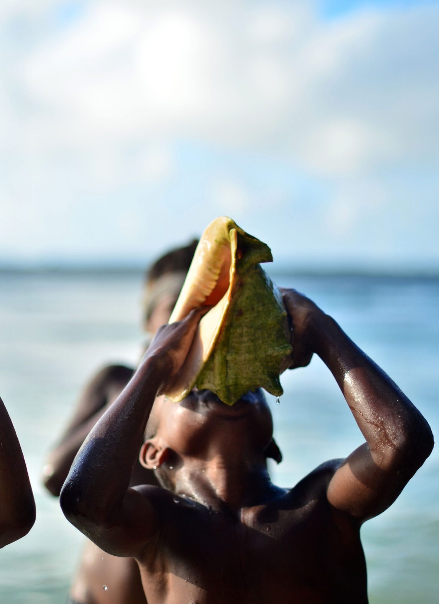 The festival begins with a marathon conch-blowing session.