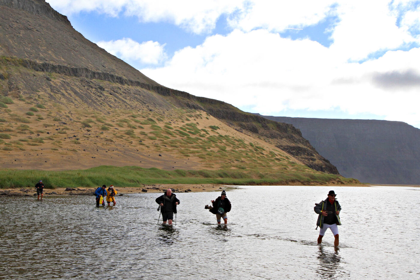 Crossing a river on the trek at Hornstrandir Nature reserve.