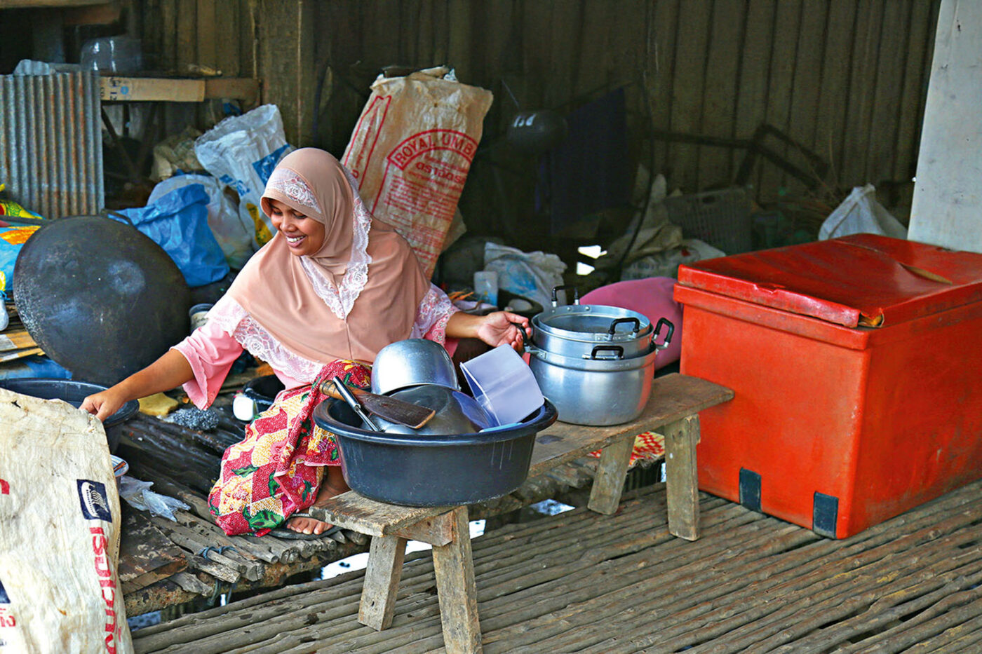 A woman sorts crabs and pots on Koh Libong.