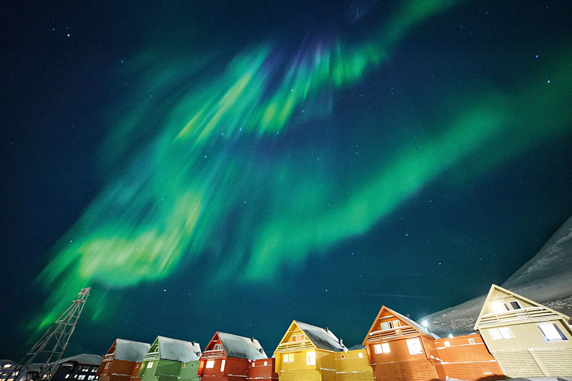 The aurora borealis lights up the sky above Longyearbyen.
