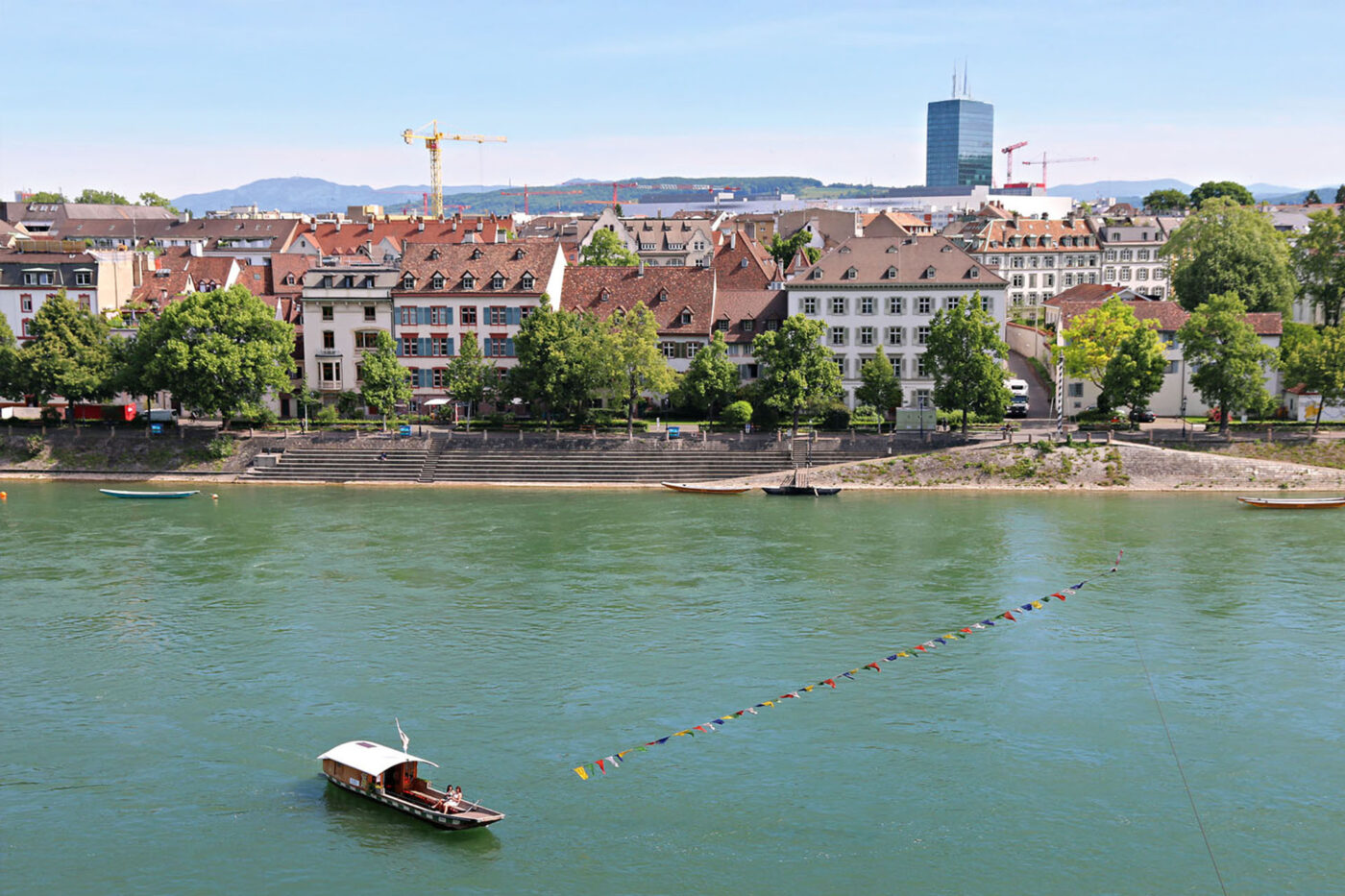 Riding the current in one of the four free ferries across the Rhine connecting Kleinbasel with Grossbasel in Basel.