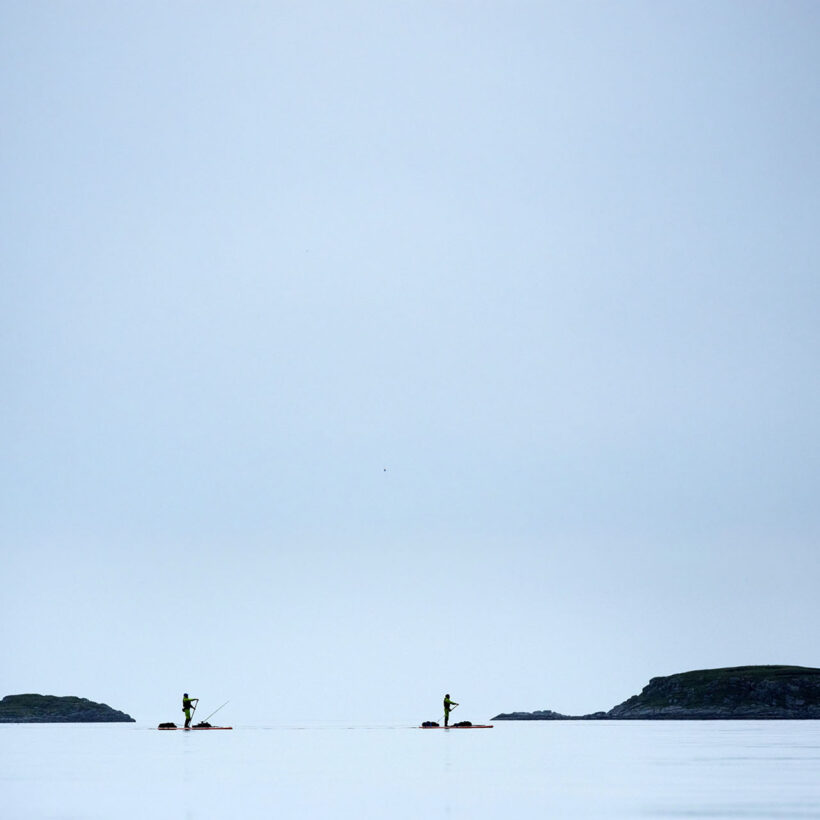 Two little specks in the big, wide sea.