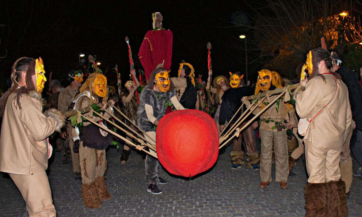 Satyrs carrying a giant penis on a rope stretcher.