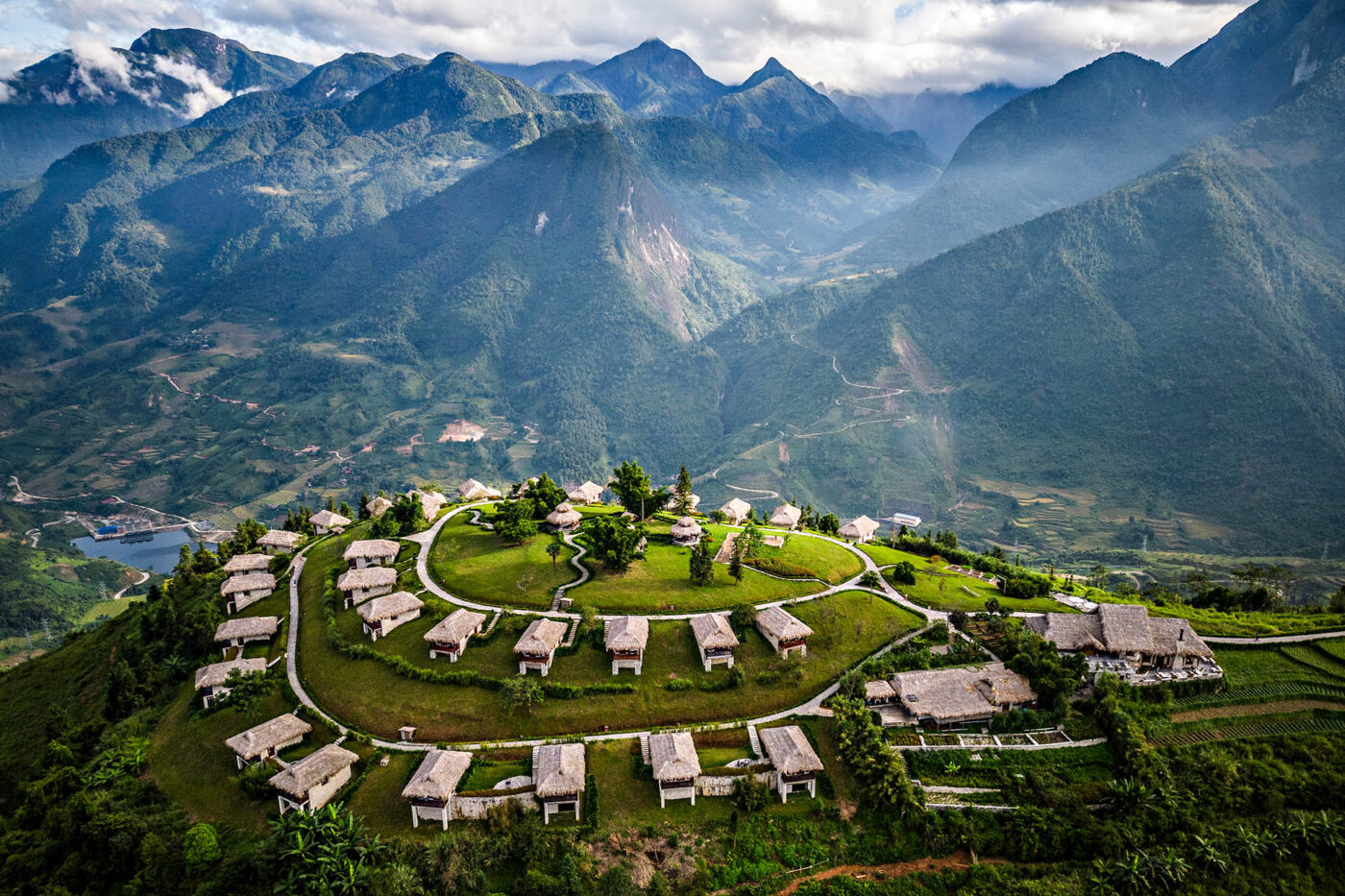 Topas Ecolodge Sapa perched on a green hilltop overlooking the mountains and valleys of northern Vietnam.
