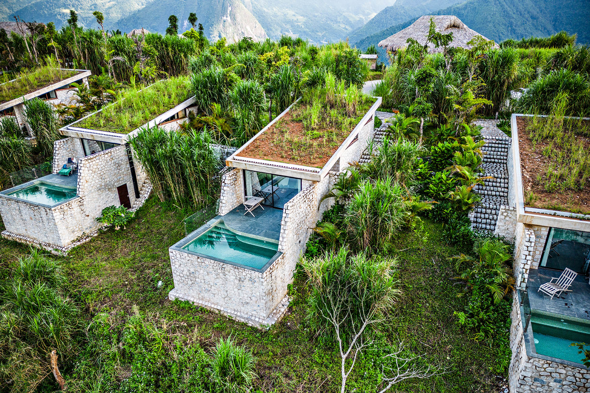 Private pool villas at Topas Ecolodge Sapa surrounded by lush vegetation in Vietnam’s Hoàng Liên Son mountains.