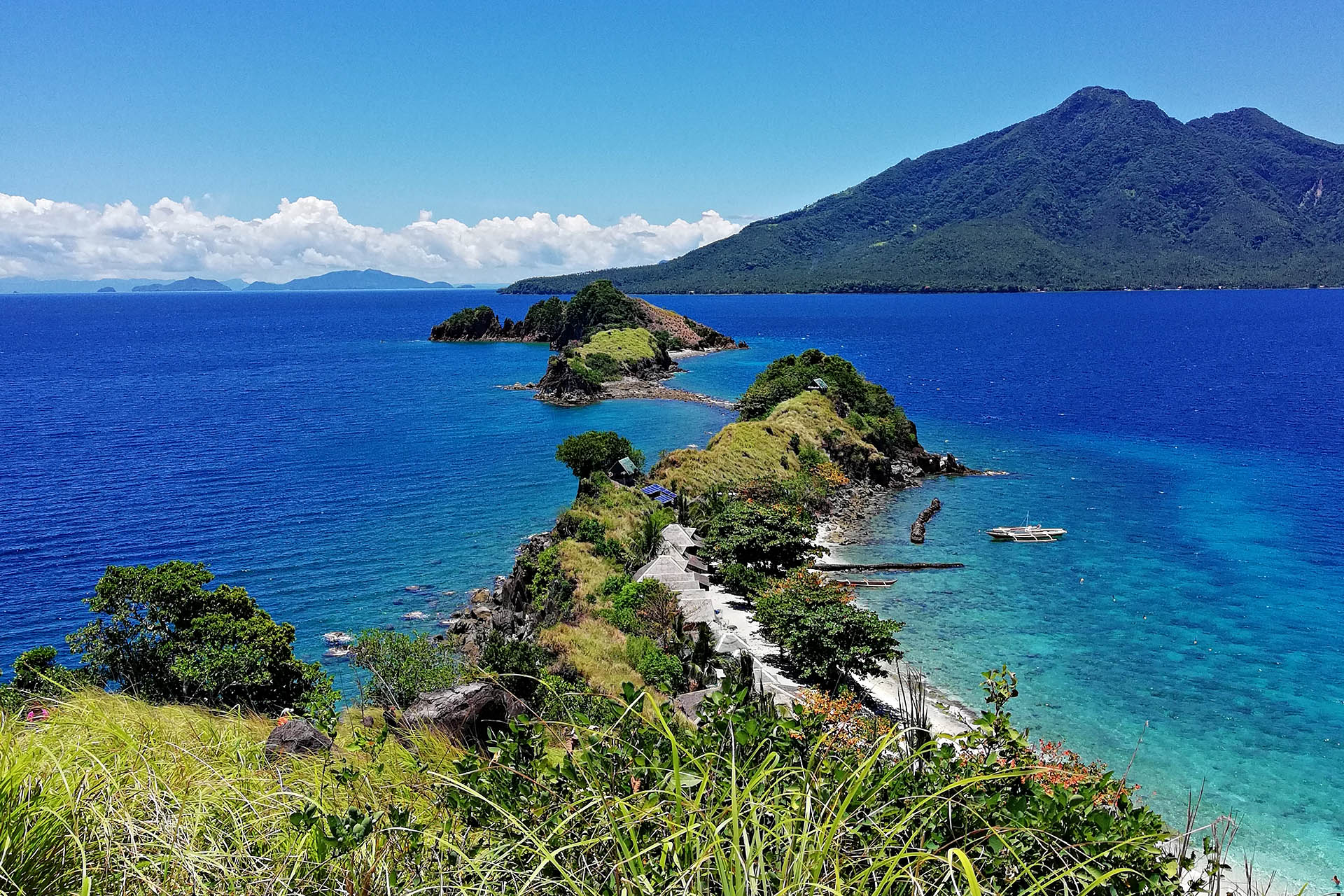 Sambawan Island’s rugged green islets surrounded by clear blue water off Biliran in the Philippines.
