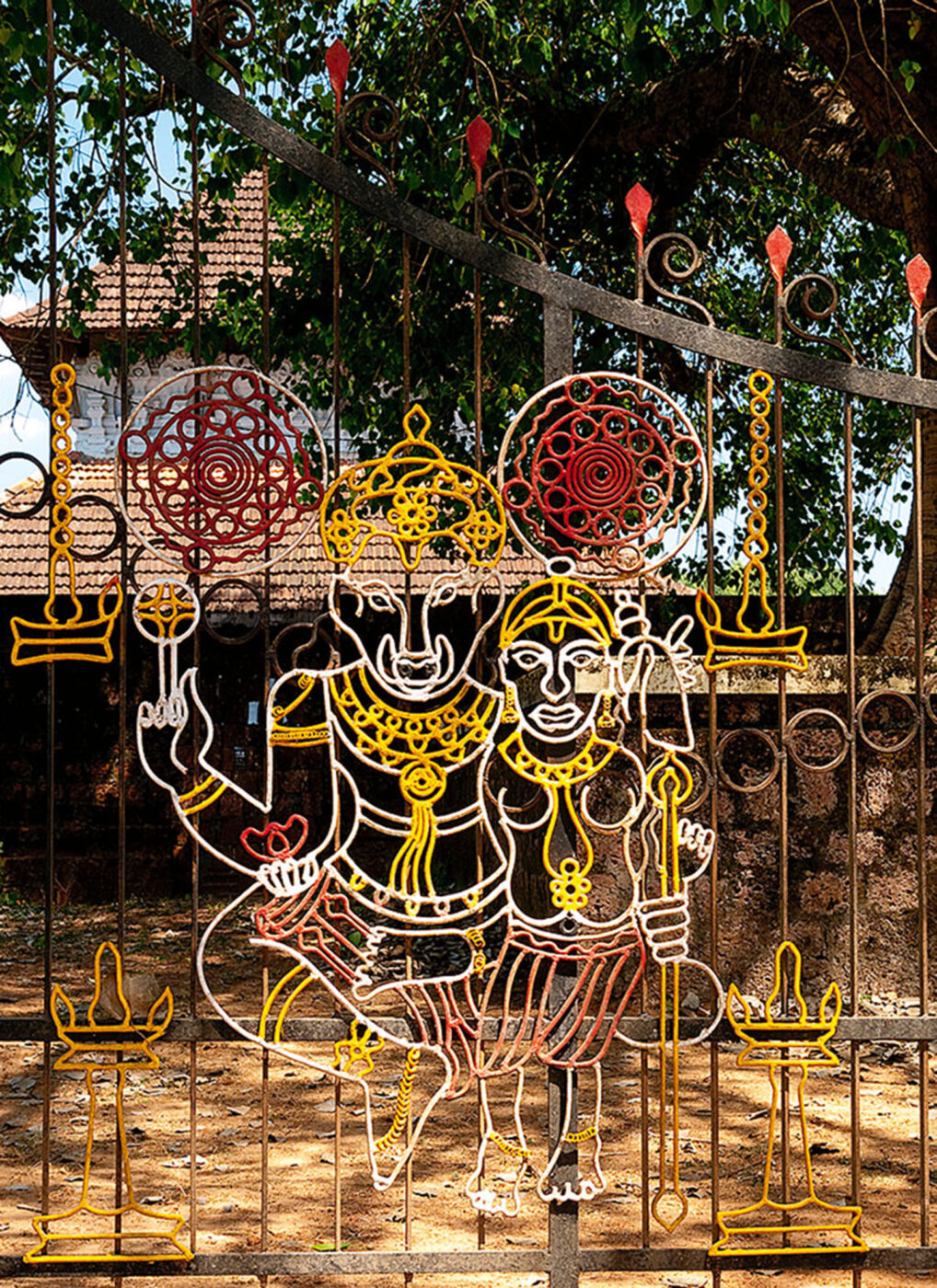 An artwork of two gods created inside of a fence.