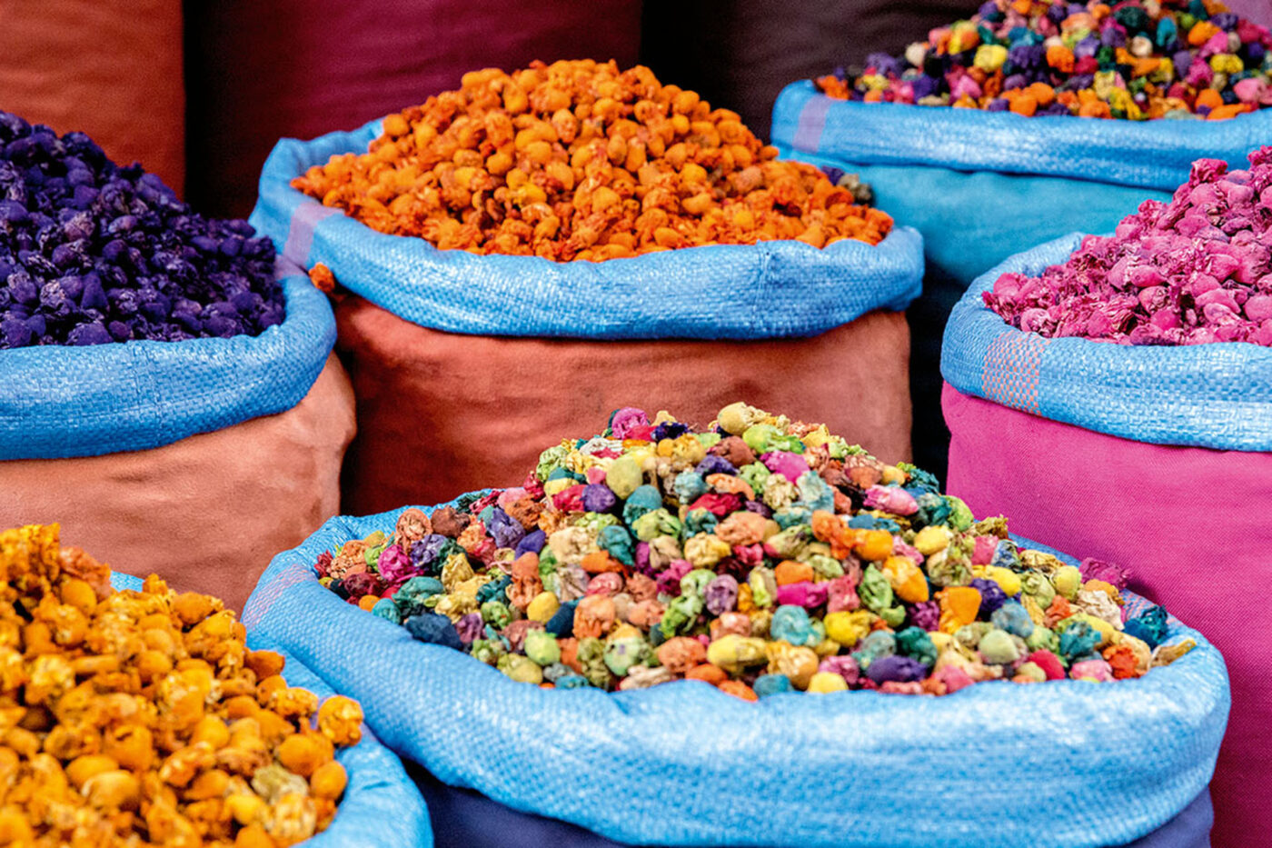 6 Bags of colourful lollies.