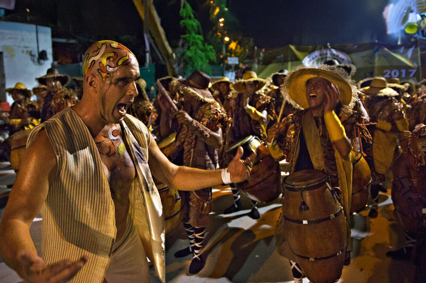 Spectators are often encouraged to interact with dancers, sometimes joining the parade.