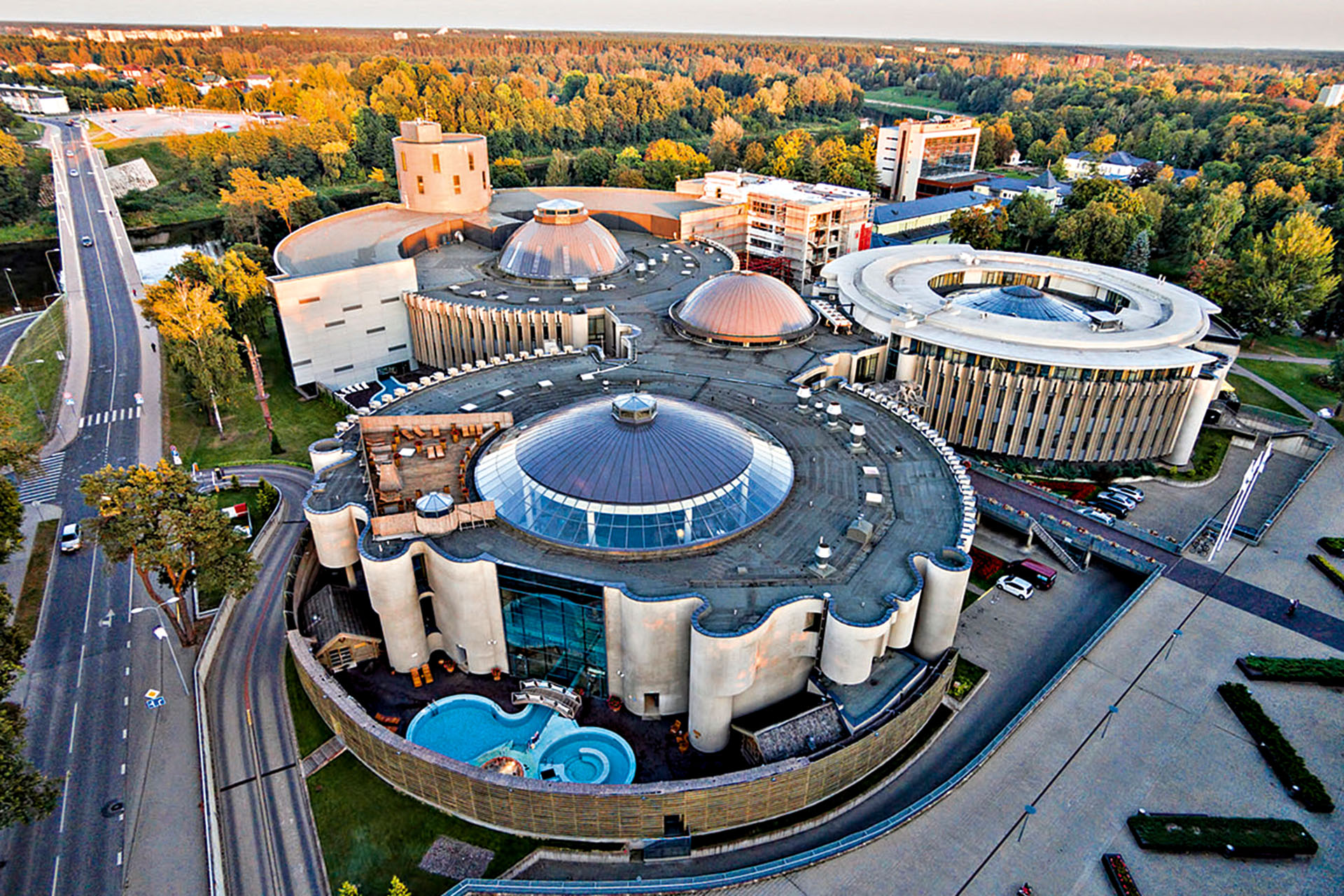 An aerial shot of a building made up of three circles.