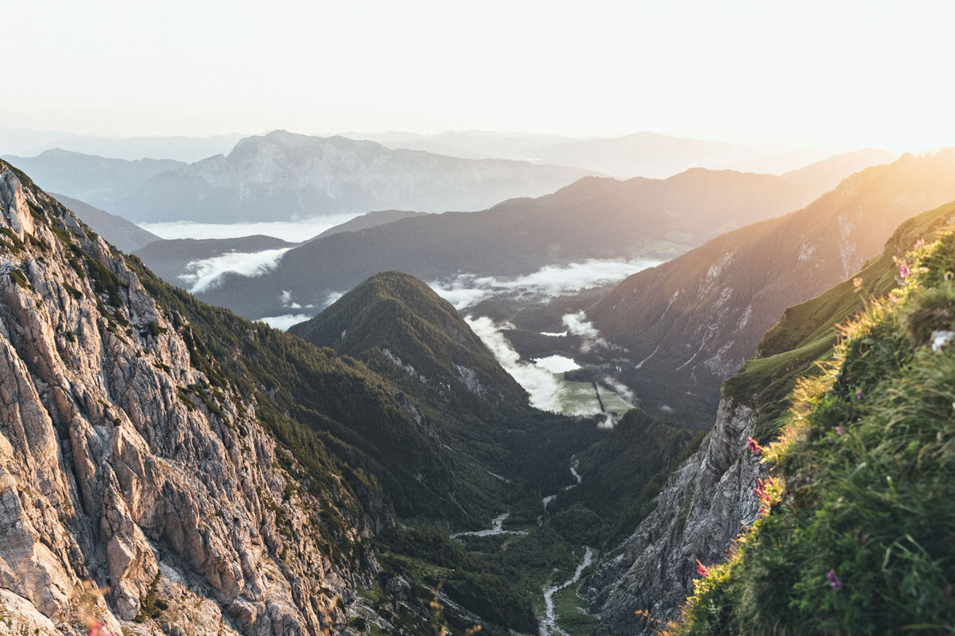 A view from the top of the mountains, with clouds below you.