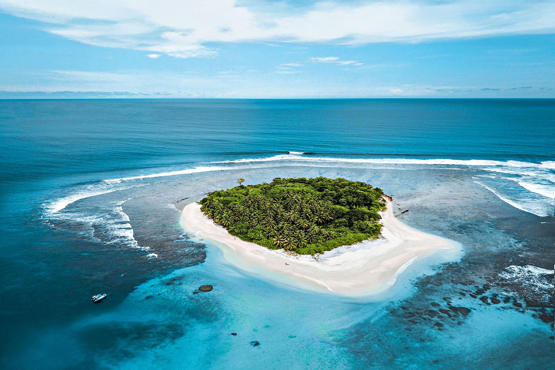 A tiny island in the middle of the ocean.