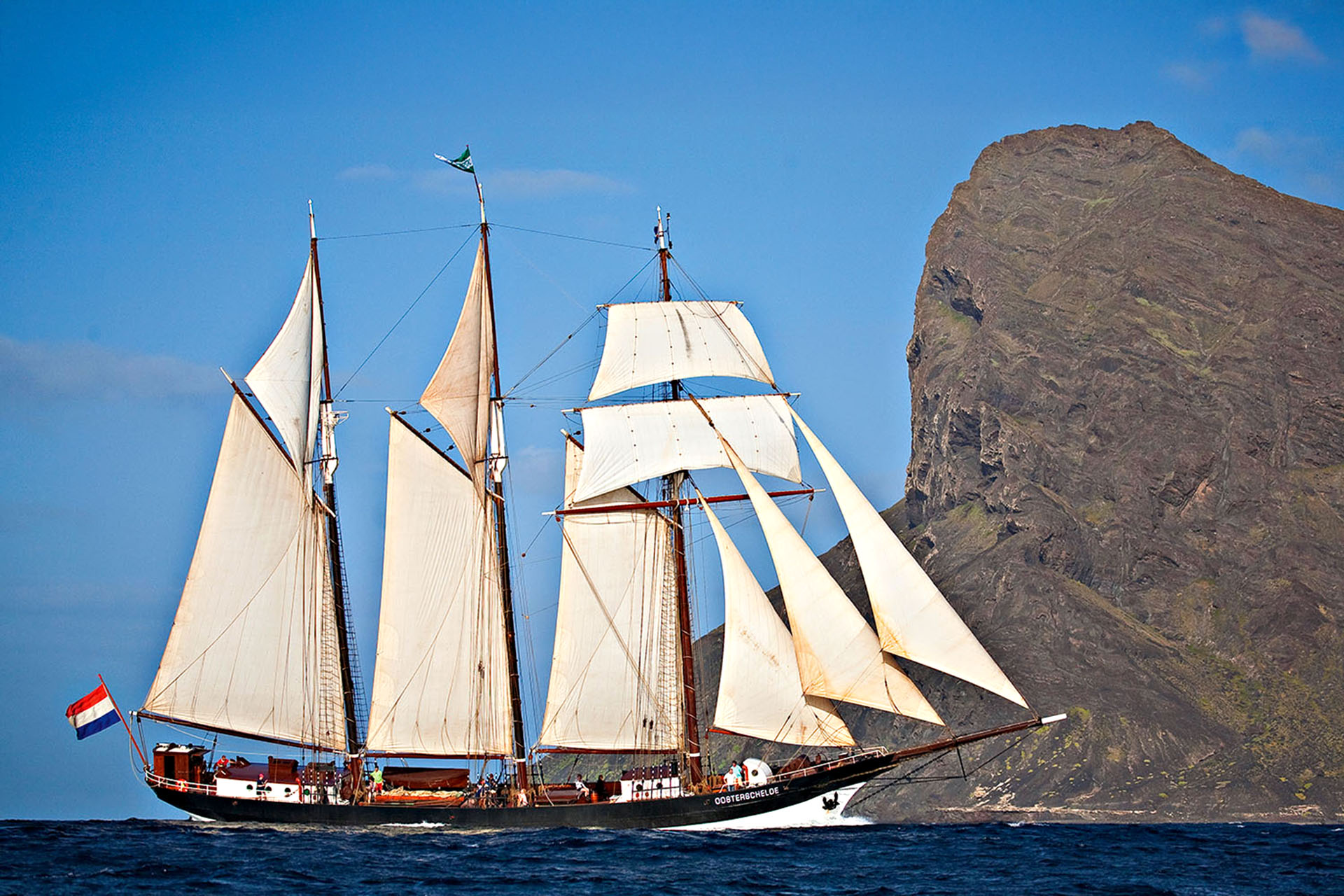 An old-fashioned ship with huge sails.