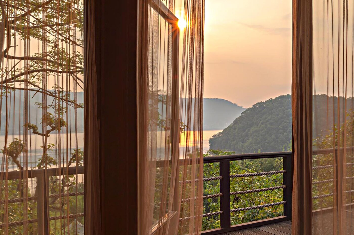 The view from the balcony of one of the villas. It looks over the lake and the lush green land.