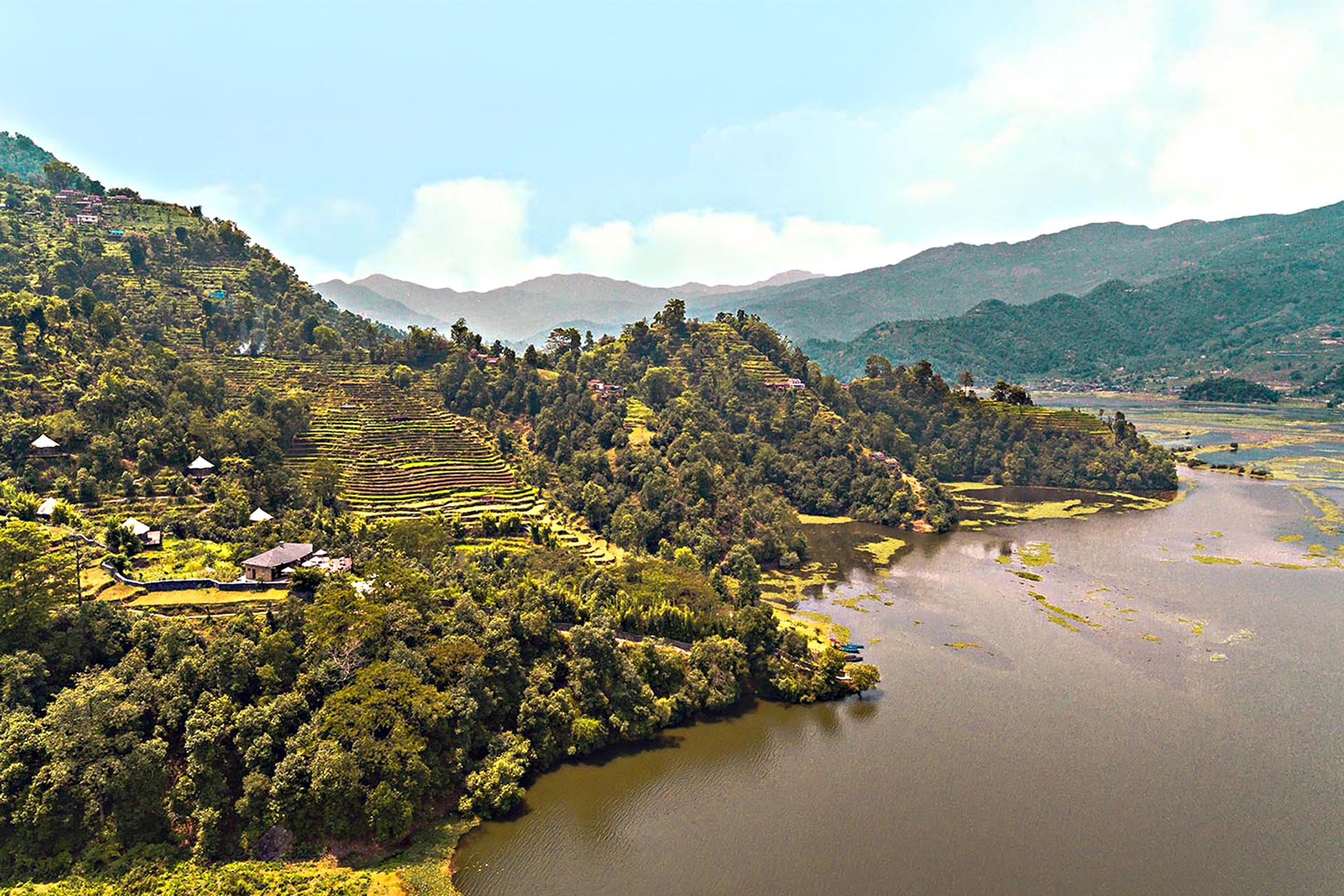 The view of the Pavillion lake, with a large landscape of greenery surrounding it.