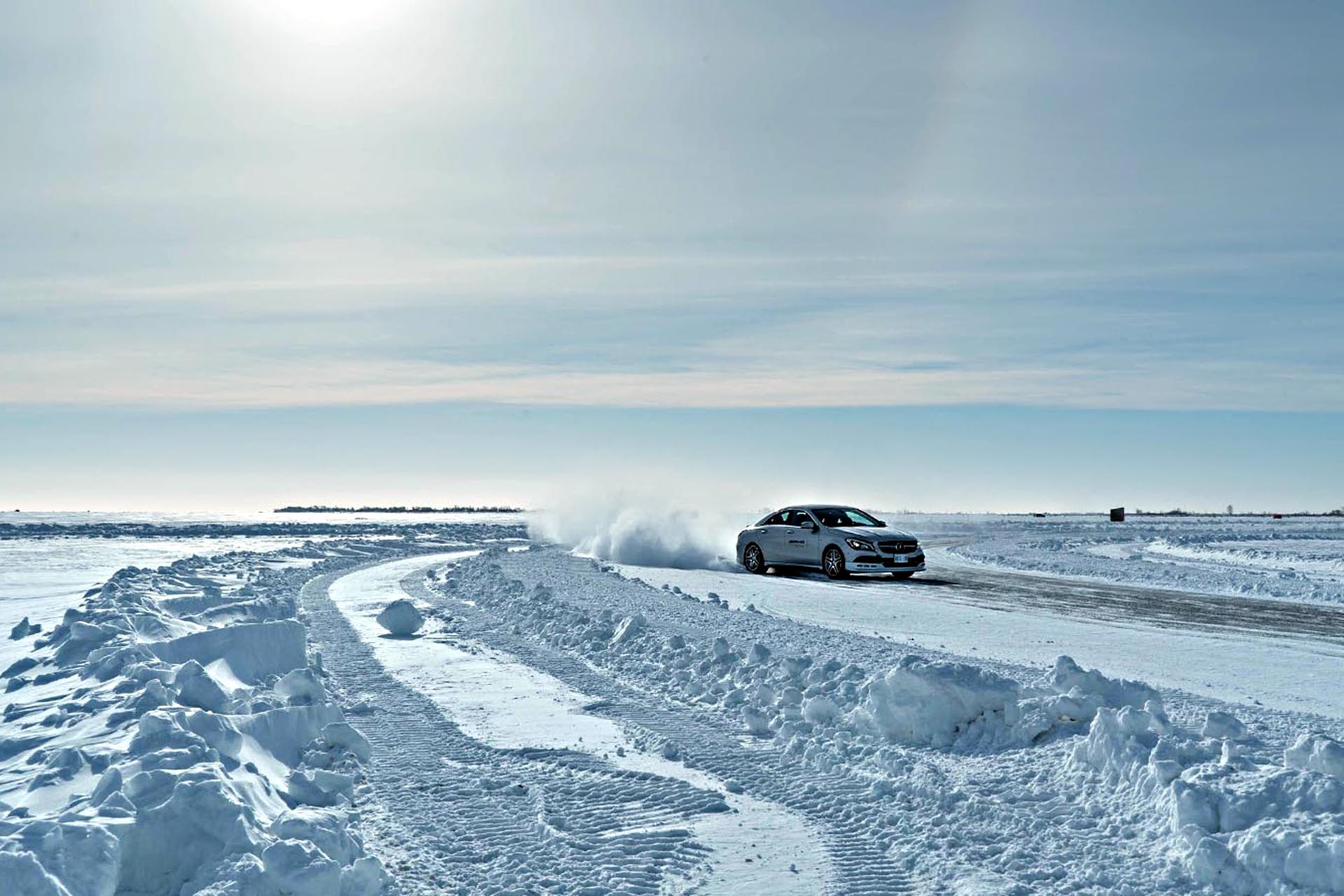 A car driving around in the snow.