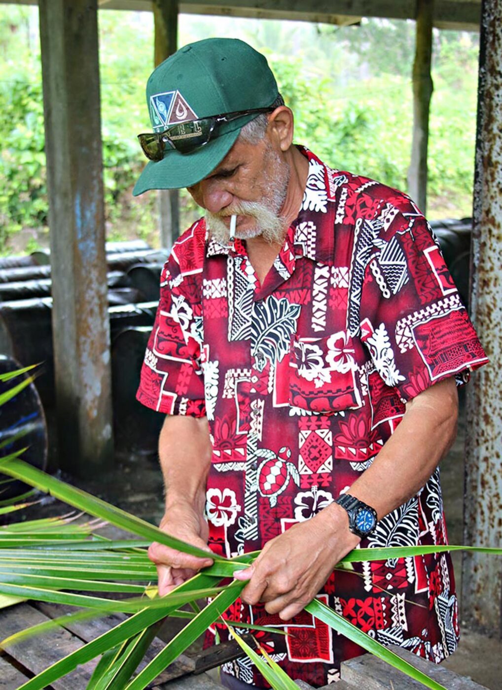 A person creating a plate out of leaves.