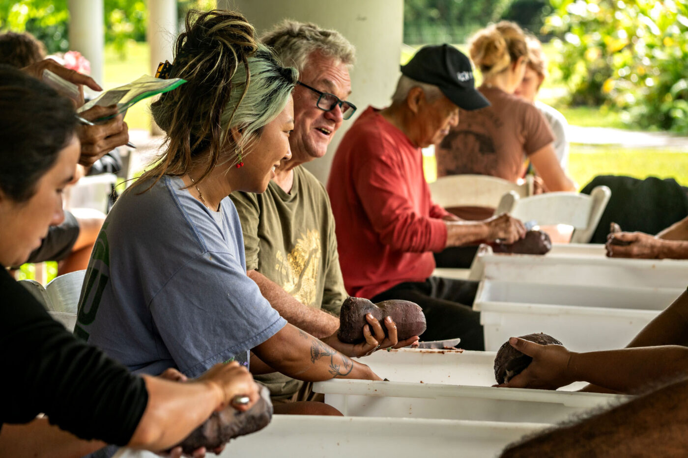 A candid shot of people chatting around a table.
